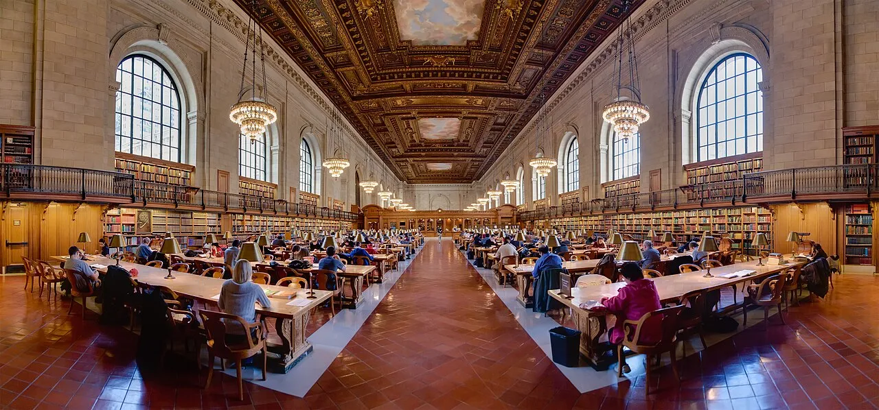 A research room lined with archives and long tables